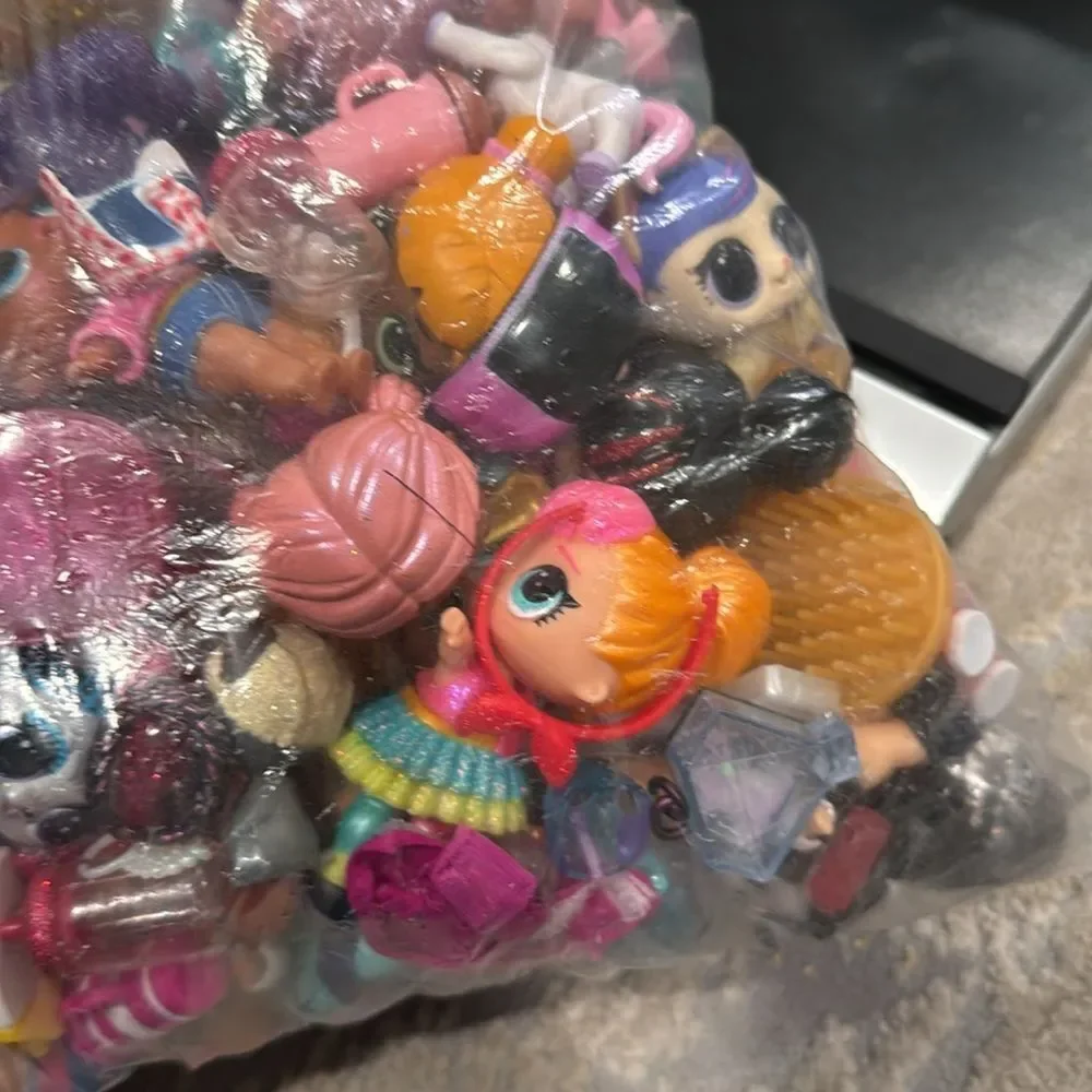 Almost 5lb of Lol dolls , dolls accessories , clothes and some furniture big lot